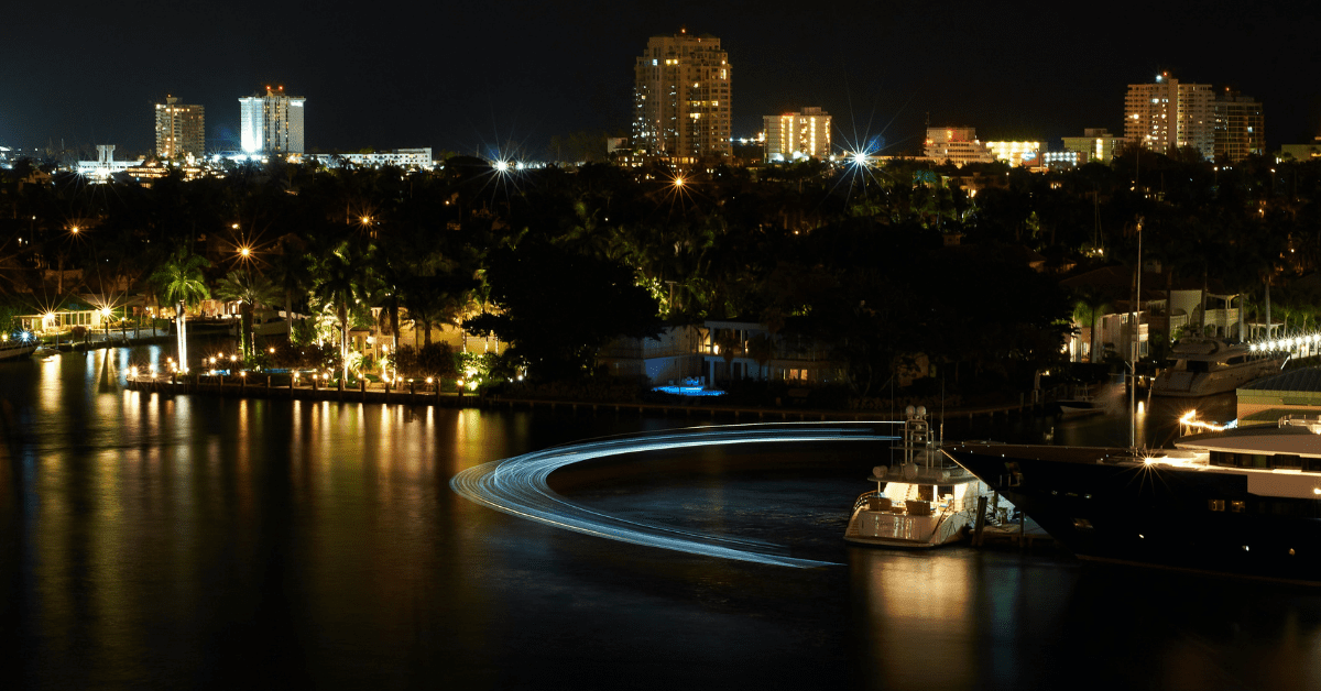 Fort Lauderdale City Landscape At Night With Lights Of Buildings Reflecting On The Water