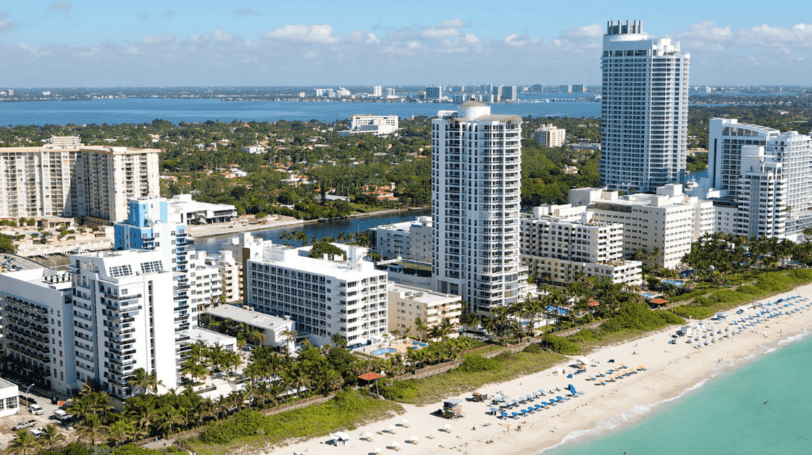 Aerial View Of Miami Beach's Condos And Hotels Overlooking The Beach