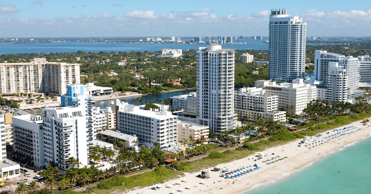 Aerial View Of Miami Beach's Condos And Hotels Overlooking The Beach